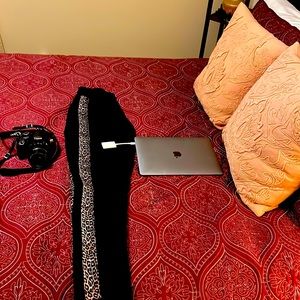 Fashionable pair of boutique animal print pants with zippers at ankles to calf’s